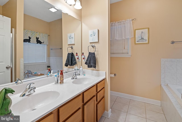 bathroom with vanity, tiled bath, and tile patterned floors