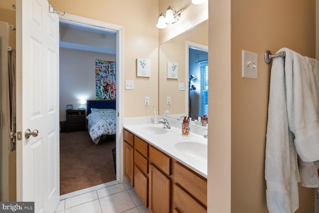 bathroom featuring tile patterned flooring and vanity