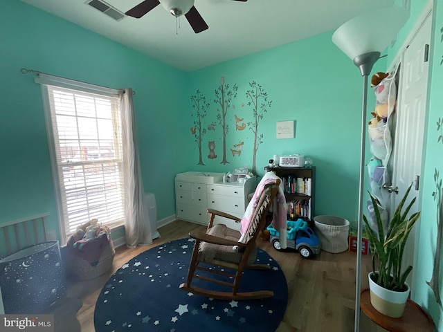 bedroom with hardwood / wood-style floors and ceiling fan