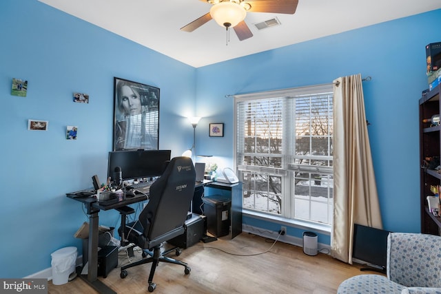 home office featuring ceiling fan and light wood-type flooring