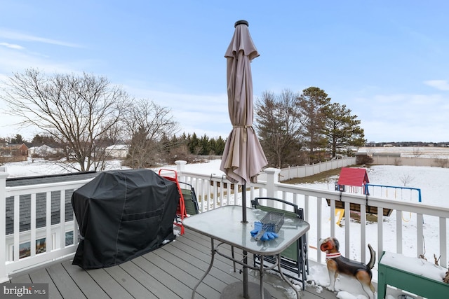 snow covered deck with grilling area