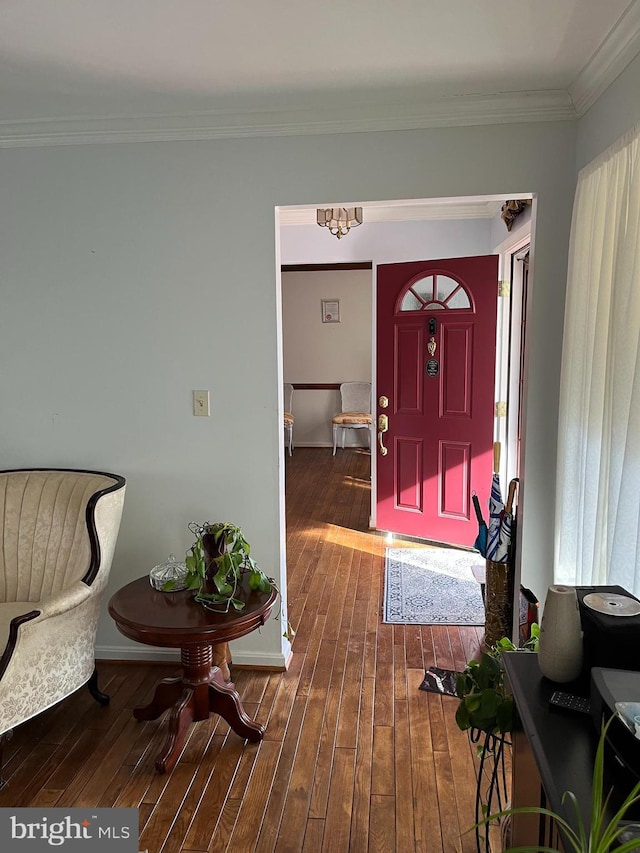 entrance foyer featuring hardwood / wood-style floors and ornamental molding