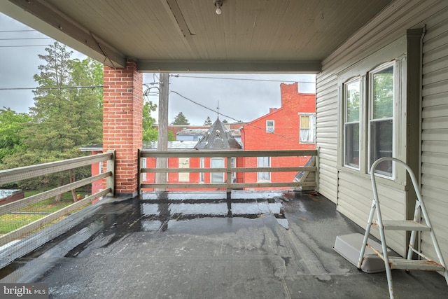 view of patio featuring a balcony