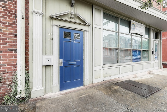 property entrance with brick siding