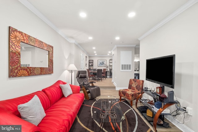 living room featuring hardwood / wood-style floors and ornamental molding