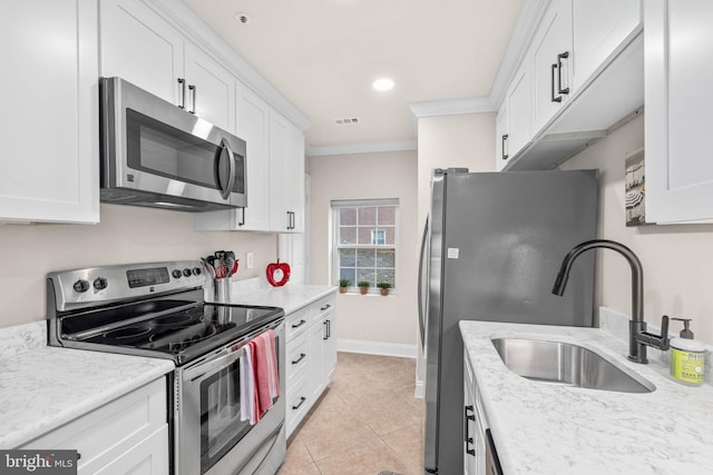 kitchen featuring white cabinets, appliances with stainless steel finishes, and sink