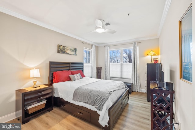 bedroom featuring ceiling fan, ornamental molding, and light wood-type flooring