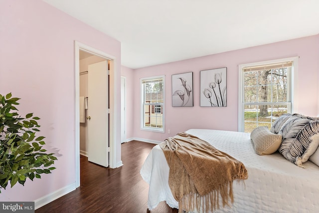 bedroom featuring dark wood-type flooring