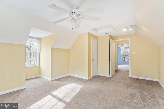 bonus room featuring vaulted ceiling and light colored carpet