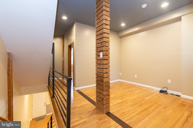 stairway featuring wood-type flooring