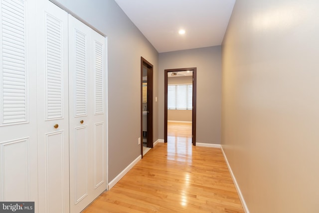 hallway with light wood-type flooring