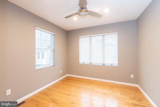 unfurnished room featuring ceiling fan and wood-type flooring