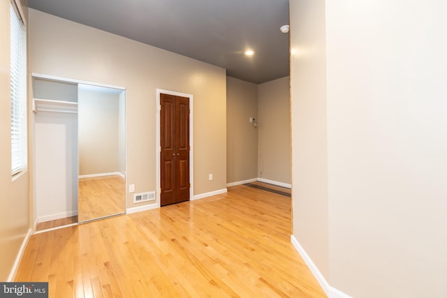 unfurnished bedroom with wood-type flooring