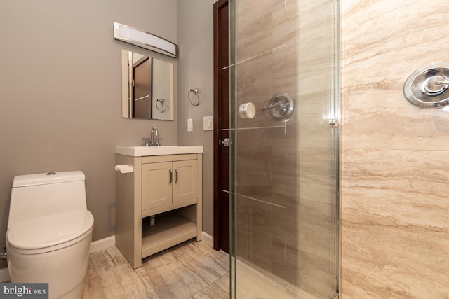 bathroom featuring toilet, a shower with shower door, and vanity