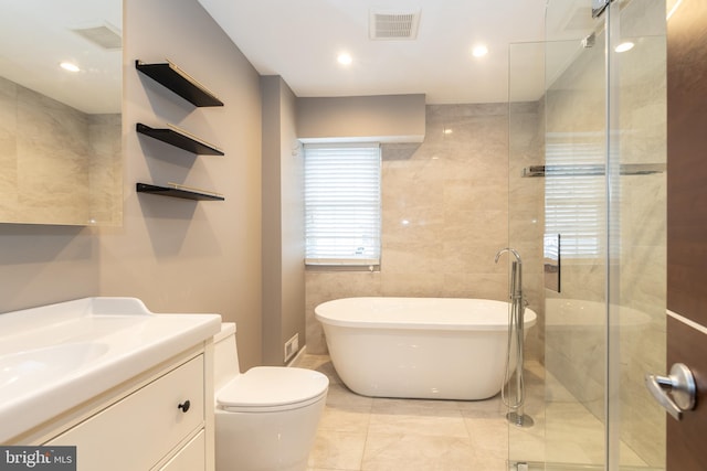 full bathroom with separate shower and tub, vanity, and toilet