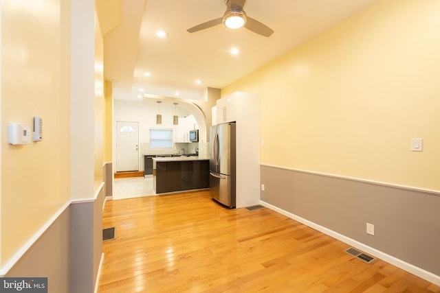 corridor featuring light hardwood / wood-style floors