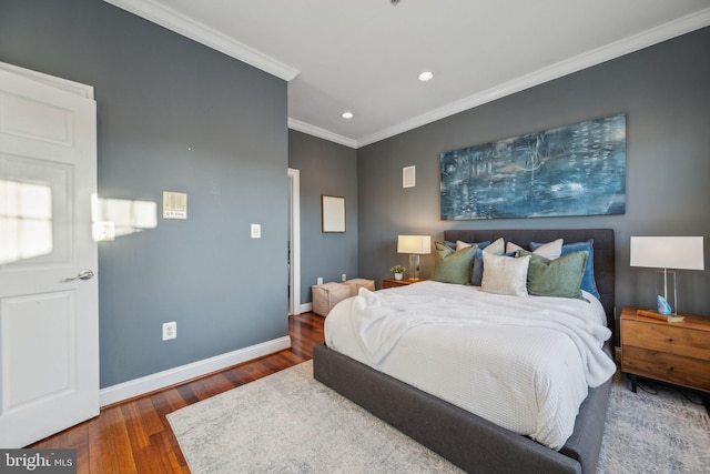 bedroom with dark wood-type flooring and ornamental molding