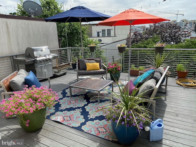 deck with outdoor lounge area and a grill