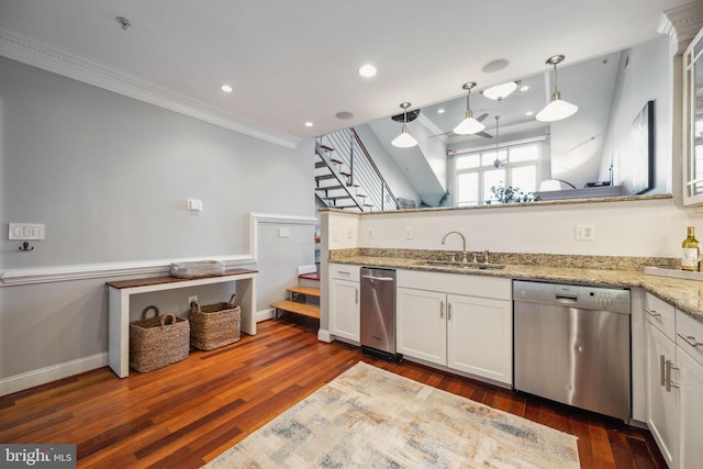 kitchen featuring light stone counters, sink, white cabinets, and dishwasher