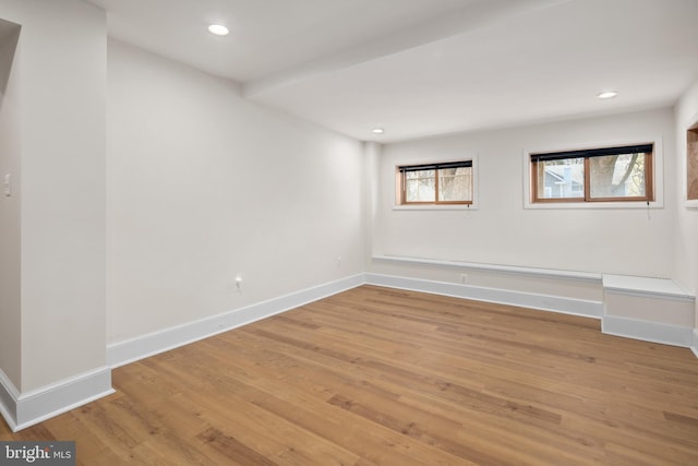 spare room with wood-type flooring