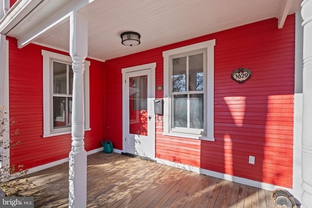 doorway to property featuring covered porch