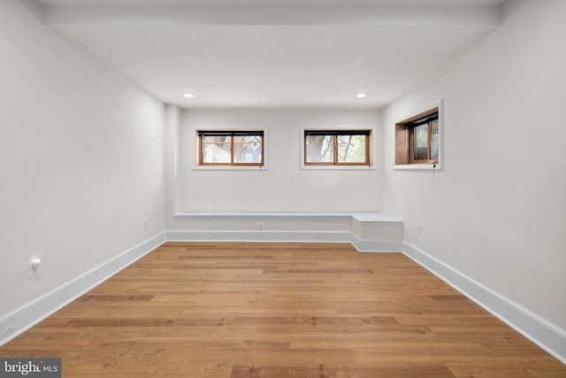 spare room with light hardwood / wood-style flooring