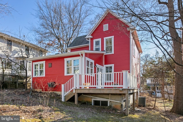 back of property featuring central AC unit