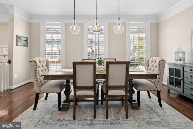 dining area with dark hardwood / wood-style flooring, plenty of natural light, and ornamental molding