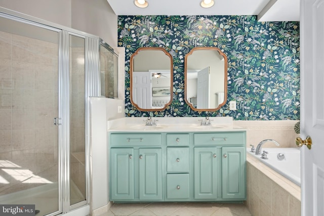 bathroom with plus walk in shower, tile patterned floors, and vanity