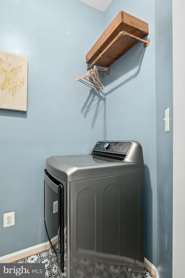 clothes washing area featuring washing machine and clothes dryer