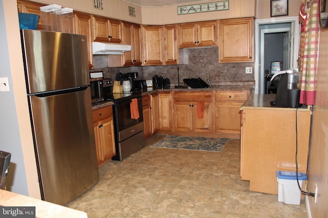 kitchen with appliances with stainless steel finishes and backsplash