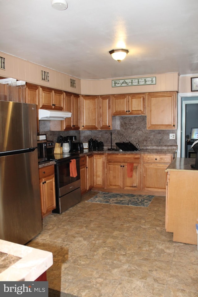 kitchen featuring decorative backsplash and appliances with stainless steel finishes