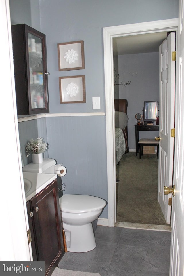 bathroom with toilet and vanity