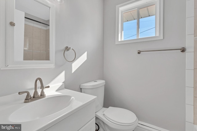 bathroom featuring toilet and vanity