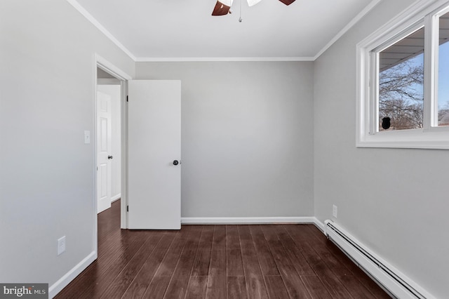 spare room with dark wood-type flooring, ceiling fan, crown molding, and a baseboard radiator