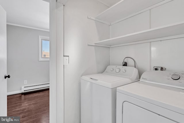 laundry area with washer and dryer, a baseboard heating unit, dark hardwood / wood-style flooring, and crown molding