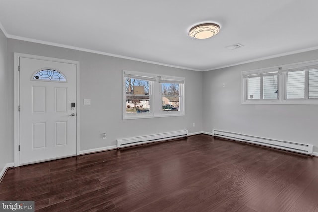 entryway featuring baseboard heating, a wealth of natural light, and dark hardwood / wood-style floors