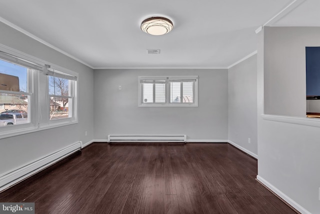 spare room with dark hardwood / wood-style flooring, ornamental molding, and a baseboard radiator