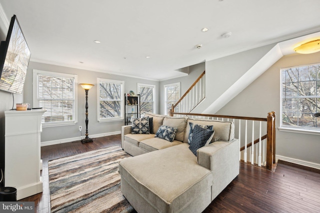 living room featuring dark hardwood / wood-style flooring and ornamental molding