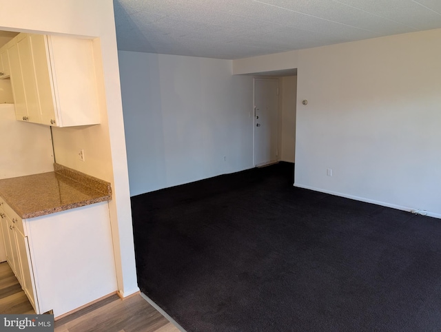 spare room featuring dark hardwood / wood-style floors