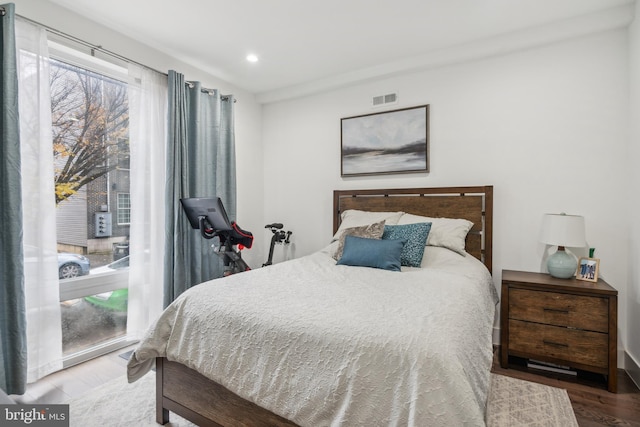 bedroom featuring wood-type flooring