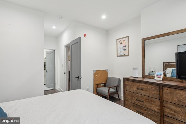 bedroom with hardwood / wood-style floors