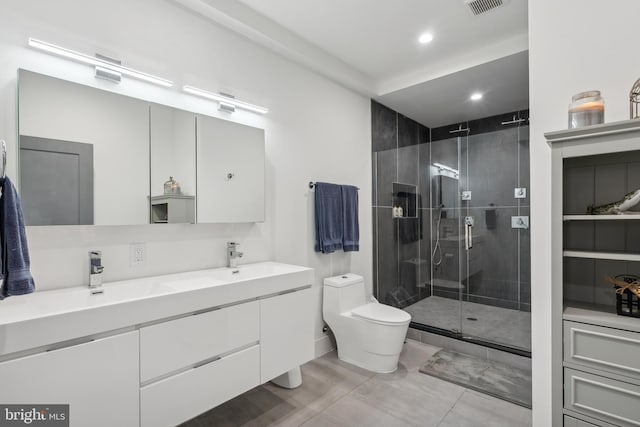 bathroom with vanity, an enclosed shower, and toilet