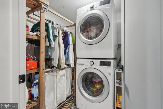 laundry area with stacked washer and clothes dryer