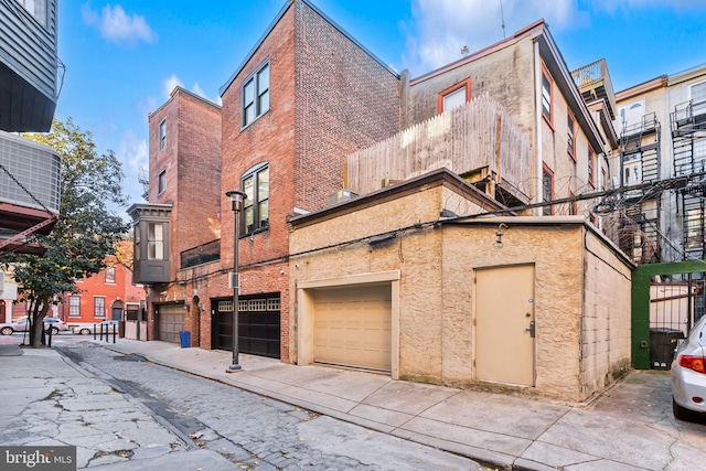 view of building exterior featuring a garage