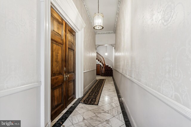 hallway featuring a notable chandelier