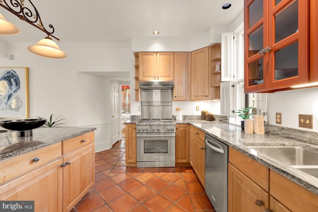 kitchen featuring light stone counters, hanging light fixtures, ornamental molding, appliances with stainless steel finishes, and tile patterned flooring