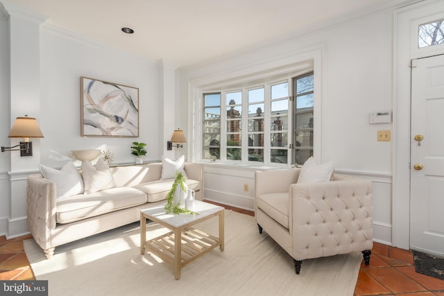 living room with crown molding, a wealth of natural light, and light tile patterned floors