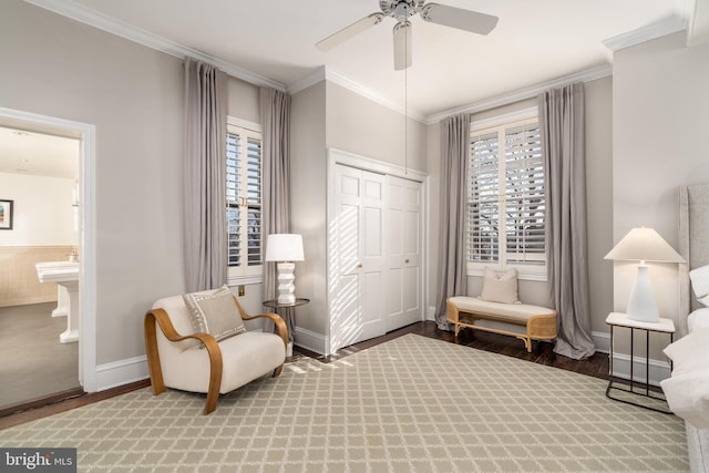 sitting room featuring hardwood / wood-style flooring, ceiling fan, and ornamental molding