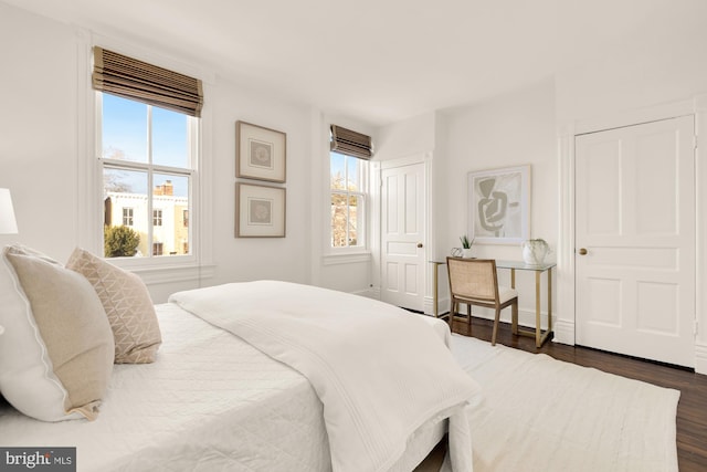 bedroom featuring dark hardwood / wood-style flooring